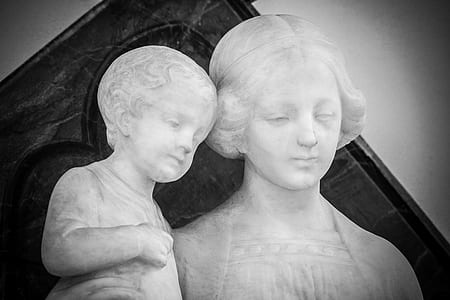 photo of concrete statue of woman and child thumbnail