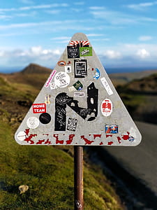 white and red road sign during daytime thumbnail