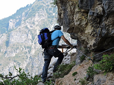 photo of man climbing on rock thumbnail