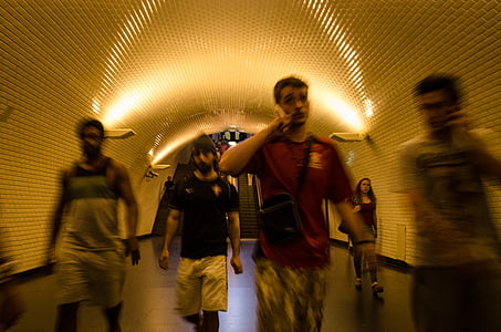 people walking under tunnel thumbnail
