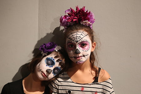 two girl with muerte face paints thumbnail