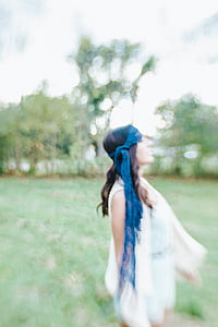 woman standing near trees thumbnail