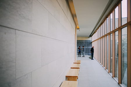 three person standing in the building thumbnail