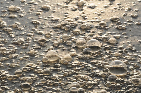 bubbles on water during daytime thumbnail