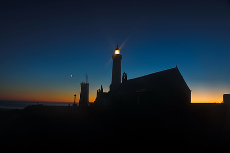 silhouette photography of lighthouse thumbnail