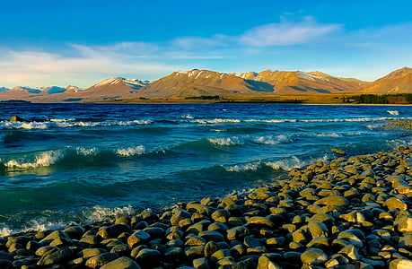 stones in seashore during day time thumbnail
