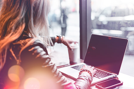 Young Freelance Woman Working Remotely from Café thumbnail