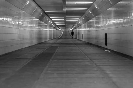 grayscale photo of underground hallway thumbnail