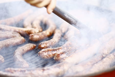 person cooking sausage thumbnail