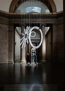two man walking inside building thumbnail