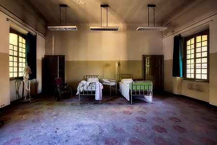 two grey hospital bed frames and light turned off thumbnail