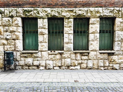 person showing brick wall with windows thumbnail