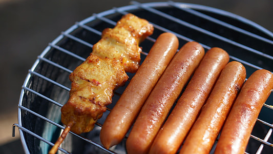 food photography of grilling pork and hotdogs thumbnail