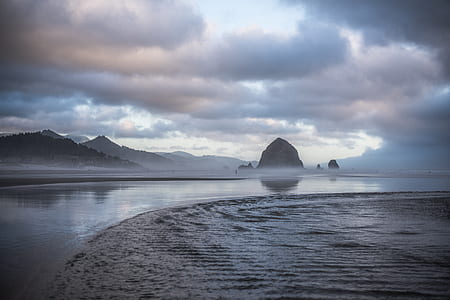 photo of seashore and body of water thumbnail
