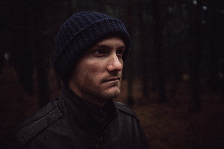 man wearing black knit cap and jacket thumbnail