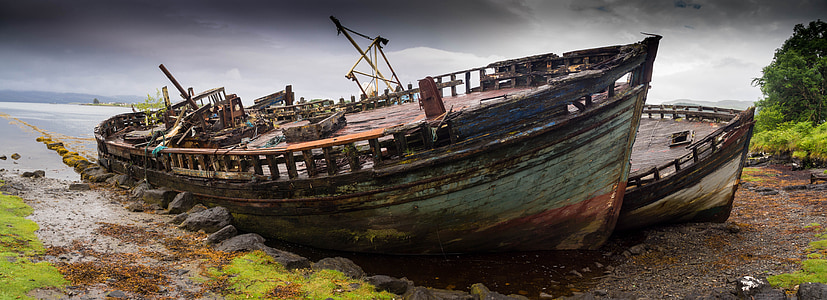 two blue and white ships on land thumbnail