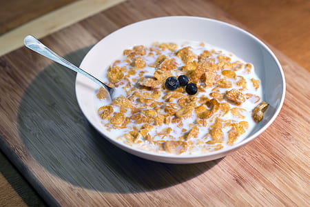 cereals with milk in white bowl thumbnail