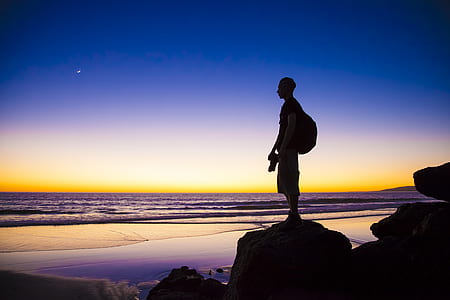 man standing on stone silhouette thumbnail