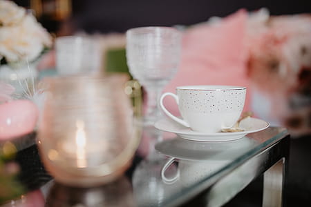 Porcelain and glass dishware on the glass table thumbnail