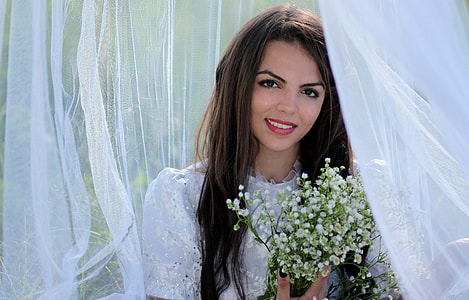 women's white crew neck wedding gown holding white flowers thumbnail