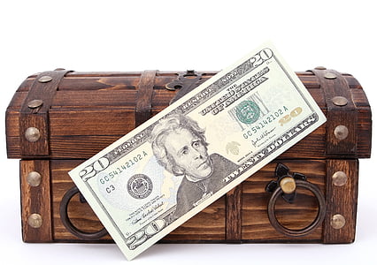 20 US dollar banknote on brown wooden chest thumbnail