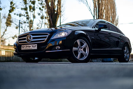 shallow focus photography of parked black Mercedes-Benz sedan thumbnail