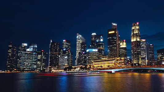 city lights near body of water thumbnail