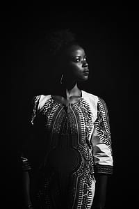 grayscale photography of woman wearing elbow-sleeved dress thumbnail