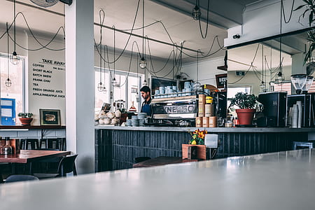 man standing near counter thumbnail