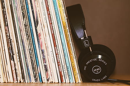 black headset beside books thumbnail