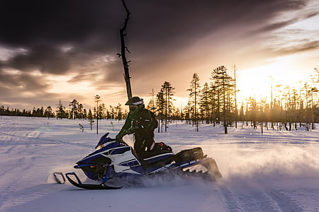 person riding snowmobile thumbnail