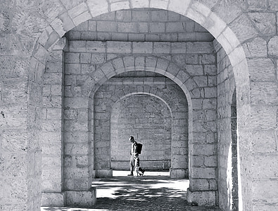 grayscale photo of person in hallway thumbnail