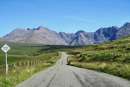 road towards mountain at daytime thumbnail