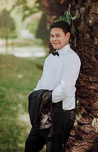 Man Wearing White Dress Shirt Posing for Photo thumbnail