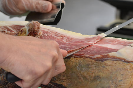 person slicing meat thumbnail