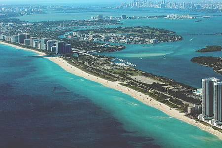 aerial view of city building surrounded by water at daytime thumbnail