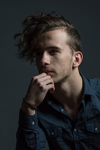 man wearing black and white collared button-up shirt thumbnail