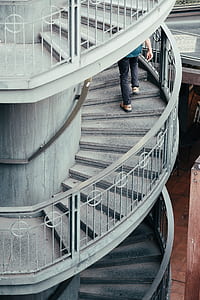 person on spiral stair thumbnail