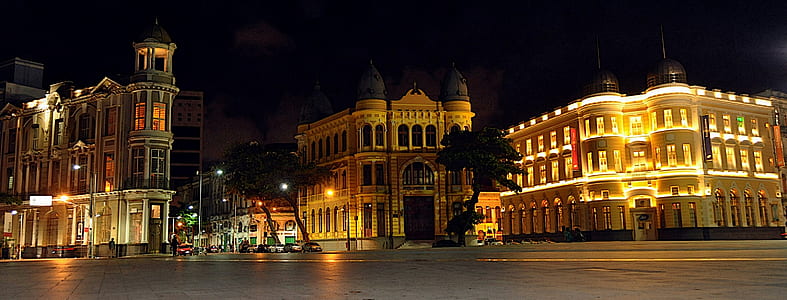 three buildings beside road thumbnail