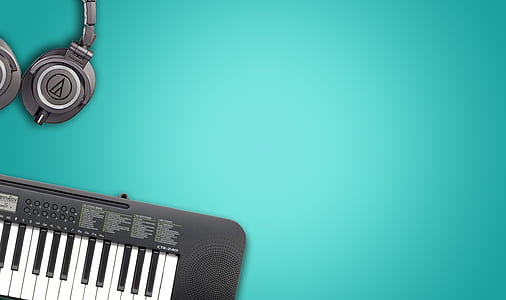 photo of black electronic keyboard and headphones thumbnail