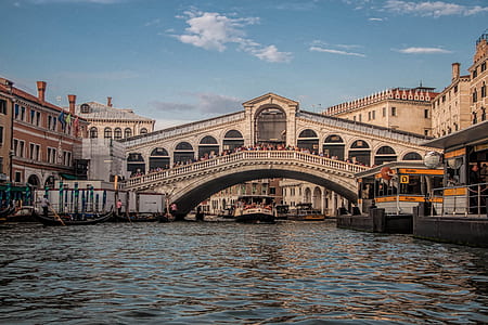 white boat under concrete bridge thumbnail