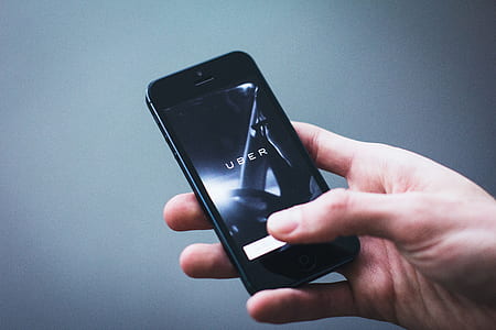 person holding black iPhone 5 thumbnail
