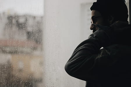man standing on side of glass thumbnail