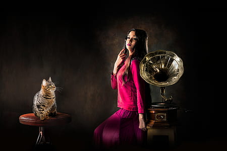 woman sitting near grammophone thumbnail