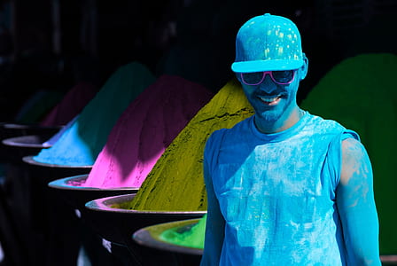 man standing with blue body paints thumbnail