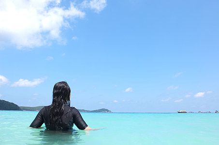 woman standing on body of water thumbnail