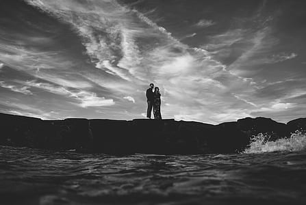 grayscale couple on top of mountain thumbnail