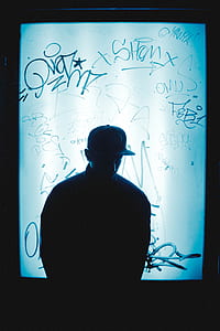 man standing against LED wall thumbnail