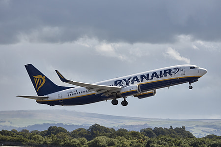 white and blue Tyanair Airplane on mid air thumbnail