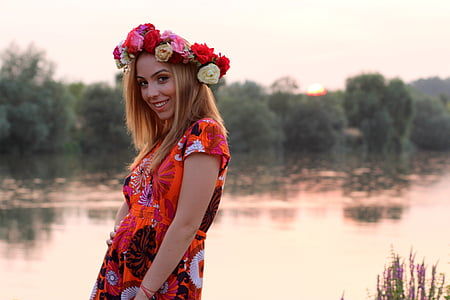 woman standing in front of body of water thumbnail